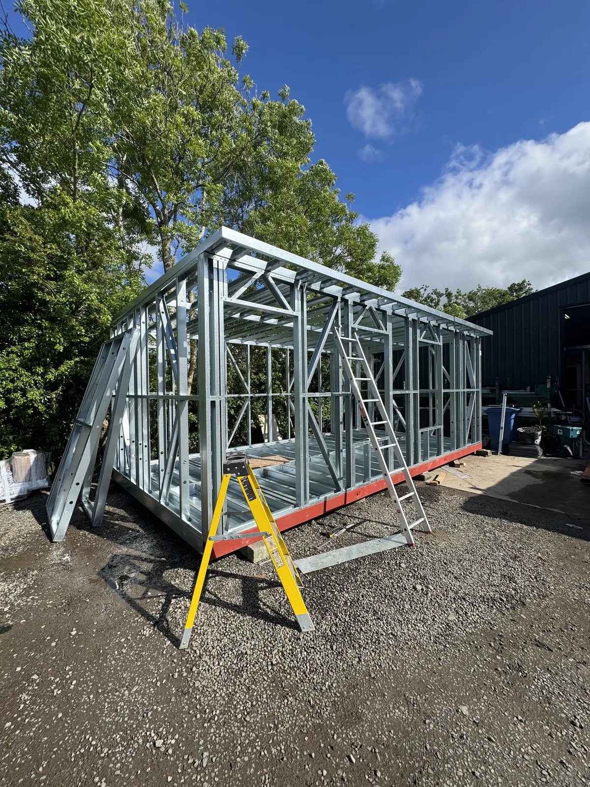 Galvanised steel frame of a garden room during the build